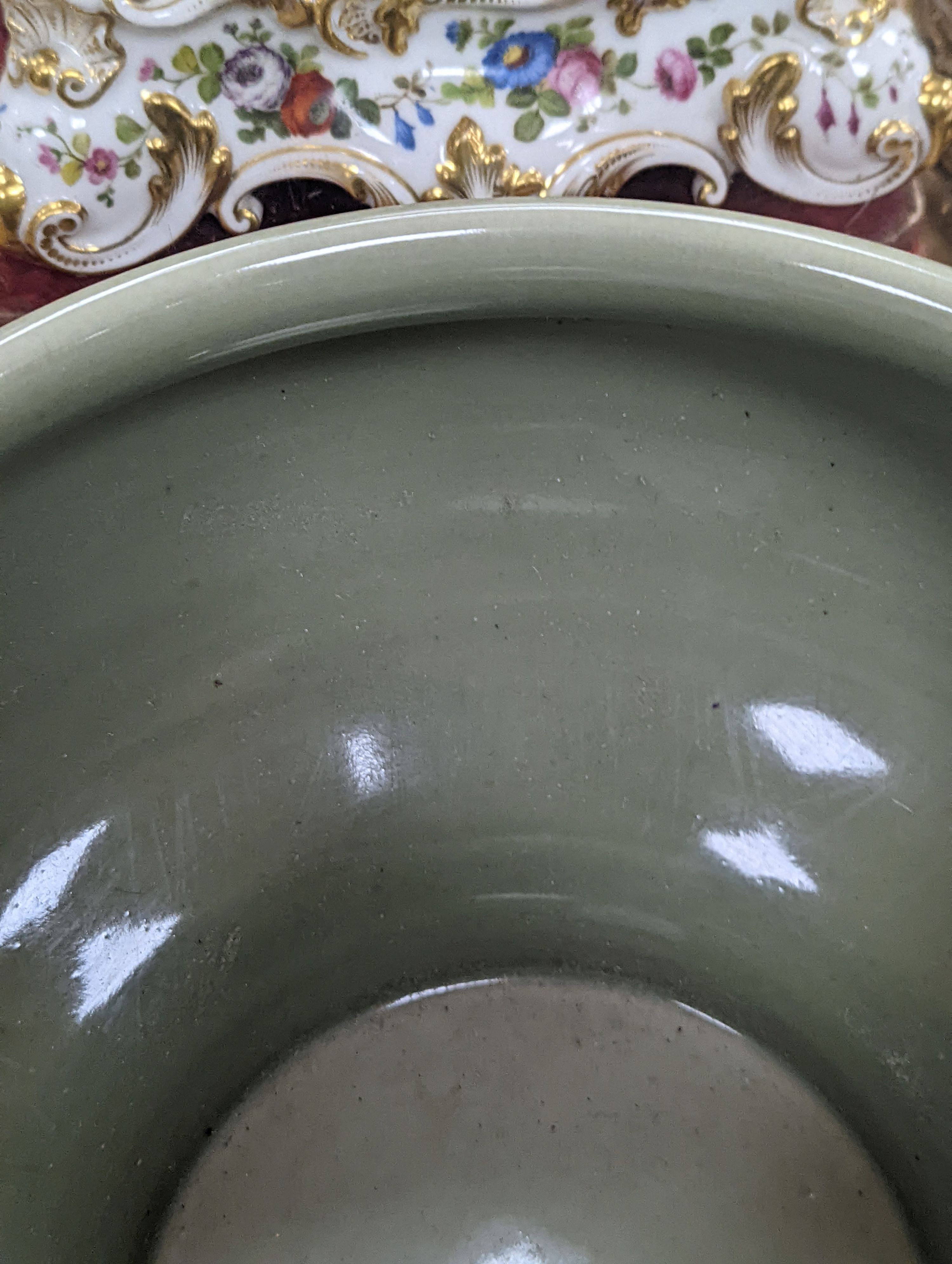 A Chinese celadon glazed bowl - 17.5cm tall